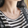 Elegant 18K gold snake chain necklace with beads on model for stylish layered look - Beaded Snake Bone Chain Necklace / Gold
