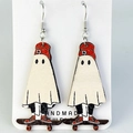 Detail of handmade wooden earrings featuring cute ghosts on red skateboards - Skateboard Ghost