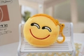 Detail of yellow plush coin purse featuring embroidered smiley face and plastic hook - Style 9 (Laughing)