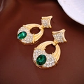 Detail of vintage gold earrings with green gems and rhinestones on dark fabric - Gold Hollow Oval Green Gemstone Drop (12#)