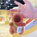 Brown Capybara plush keychain with green crossbody bag and Chinese embroidery - Dark Brown Green Fortune + Gold Clip