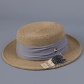 Detail of boater straw hat with gray ribbon, metal logo, and UV protection tag - M (56-58cm) / Haze Blue