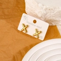 Gold plated stainless steel stud earrings featuring a minimalist letter X design - Letter X
