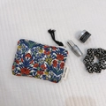 Floral cotton pouch with colorful vintage pattern and black tassel zipper detail - Vintage Blue Red