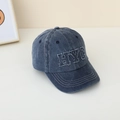Close-up of the HYC white embroidery on the washed dark blue denim baseball cap - NYC Navy Blue