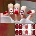 Detail of Christmas nail stickers featuring Santa Claus and red checkered patterns - CS426