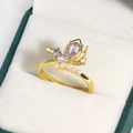 Golden butterfly ring featuring purple teardrop stones and white pearls on velvet - Purple Teardrop Butterfly (Gold 21)