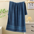 Thick navy blue cotton bath towel with geometric jacquard border hanging on wood - Luxury Cotton Bath Towel (Dark Blue) / 70*140cm