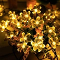 Solar powered cherry blossom LED string lights in warm yellow glow for outdoor decor - Cherry Blossoms (warm Colors)