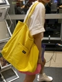 Minimalist yellow canvas tote bag with UNSP label and large exterior pocket - Yellow