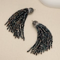 Macro view of black 2mm seed bead tassels with rhinestone caps on textured paper - Black Burgundy