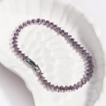 Macro detail of marquise-cut purple zircon stones set in a silver tennis bracelet - Purple Zircon - Silver