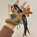 Brown plush bear keychain with blue hat and star charm on woven lanyards - Charm / Long-eared Dog
