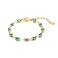 Detailed view of 18K gold plated Hamsa Hand and Green Evil Eye charms on bracelet - Green