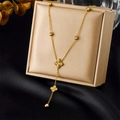 Luxury gold necklace with diamond-set clover charms on an elegant black silk display - Four Leaf Clover Tassel Necklace (N3105) / Gold