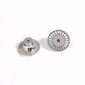 Macro shot of polished silver earring lifters showing center hole and radial texture - Silver Heart Shaped Lift Style (3)