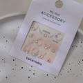 Detailed view of silver-framed pearl and rhinestone nail charms on display card MJ-062 - Model MJ-062 Silver Foil