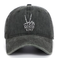 Close-up of skeleton hand embroidery and Good Vibes text on washed cotton baseball cap - One Size / Army Green