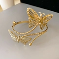 Elegante vergulde open armband met dubbele holle vlinderontwerpen voor dames - Zelfde zijde vlinder / Goud-Vlinder