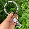 Zebra print O-shaped PU leather keychain bracelet with gold ring and tassel detail - Zebra Print