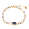 Detailed close-up of golden tennis bracelet with blue square crystal and white diamonds - Gold Blue Zirconia