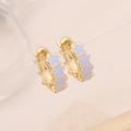 Chic gold hoop earrings with light purple star patterns in a minimalist fashion style - Purple