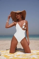 Detail of white cutout swimsuit with sequined starfish on a sunny beach setting - S / White