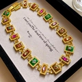 Detail of vintage gold necklace with multi-color gemstone links in a display box - 9# Vintage Court Gemstone Patchwork Necklace - Multicolor