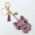 Pink rhinestone cat keychain with golden lobster clasp and purple leather tassel charm - Purple