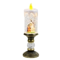 Makro-Detail der Weihnachtskerzenlampe mit Krippe und silbernem wirbelndem Glitzer - Krippe