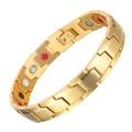 Macro shot of gold-plated magnetic health bracelet with multicolor inlay stones - Gold
