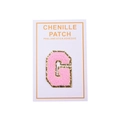 Detail of pink chenille letter G patch with gold glitter border and adhesive backing - Letter G