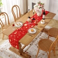Modern red Christmas table runner with golden festive patterns on a wooden dining table - Printed Red Lucky Clouds