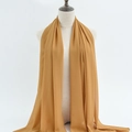 Solid ginger yellow chiffon hijab scarf for women displayed on a mannequin - 9