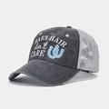 Detail of embroidered BARN HAIR DON'T CARE text on a washed cotton ponytail mesh cap - Dark Grey with Grey Mesh, Barn Hair, Blue Horseshoe (Color No. 11)