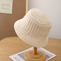 Close-up of beige knit bucket hat showing thick texture and warm woolen material - Adjustable / Beige