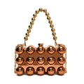 Detailed close-up of rose gold acrylic clutch with metallic sphere rivets and bead handle - Brown