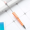 Beadable pen featuring an orange and white gingham pattern with sleek metal accents - Orange White Gingham (126)