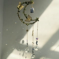 Blue crystal moon wind chime with vine butterfly details and hanging crystal prisms - Lapis Lazuli