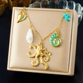 Gold bamboo chain necklace with blue octopus, conch shells and turquoise stone pendants - Octopus Style (N3527)