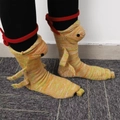 Close-up of knit crocodile socks showing colorful stripes, fins and button eye detail - Chameleon-Thickened