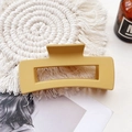 Detail view of a yellow matte rectangular hair claw clip on a stylish textured background - Large Matte Square Claw-Ginger Yellow