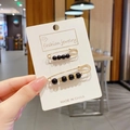 Set of two gold pins with black pearls in two sizes on jewelry display card - Black Safety Pin Style