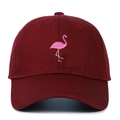 Close-up of pink flamingo embroidery and reinforced stitching on a burgundy baseball cap - Burgundy