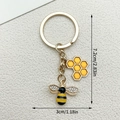 Cute golden bee keychain with yellow hexagonal honeycomb pendant and rhinestone wings - Bee Honeycomb Keychain (LS161)
