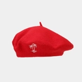 Detail of red wool beret showing premium fabric texture and white coconut tree embroidery - Red