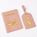 Close-up of pink PU leather passport holder and luggage tag with gold world map stamp - Pink Map