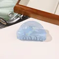 Detailed view of cloud-shaped light blue pearlescent hair claw clip with strong teeth - PVC 8cm Round Head - Iridescent Blue