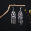 Close-up of Bohemian earrings with pink enamel inlay and hanging silver leaf tassels - Pink Blue Yellow Enamel Teardrop Tassel Style (E6143-1)