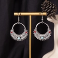 Bohemian silver earrings with red and blue beads hanging on a gold jewelry display stand - S4300-1 Blue Circle Marquise Earrings